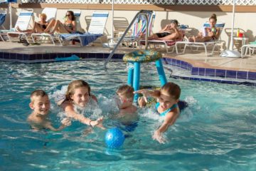 Kids playing in the palm crest pool